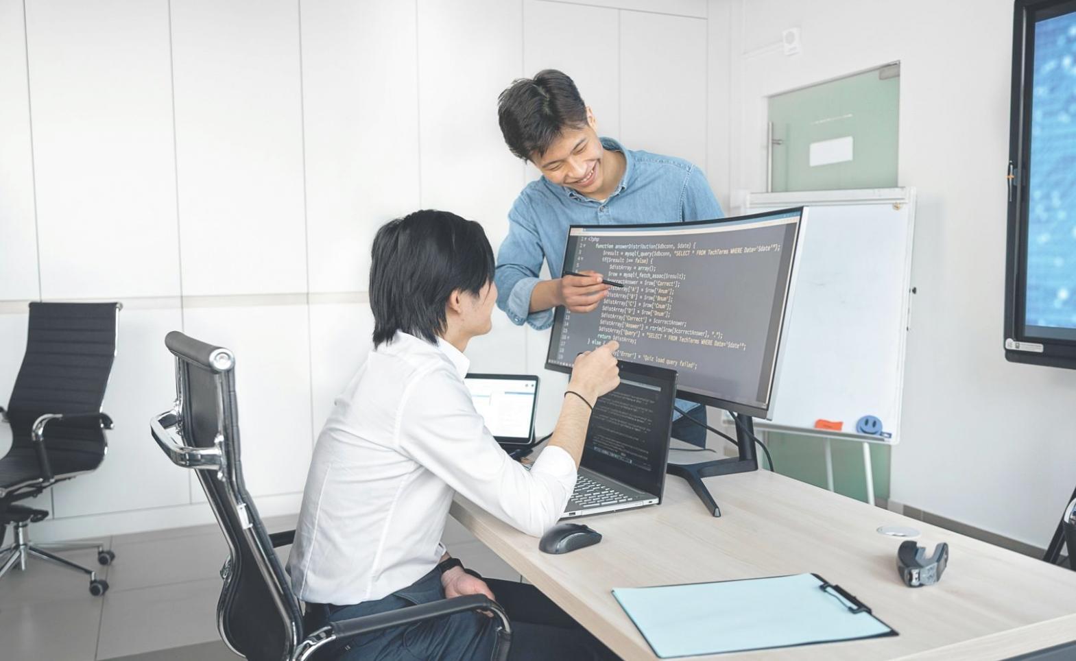 Mobile development workspace showing app design and coding environment